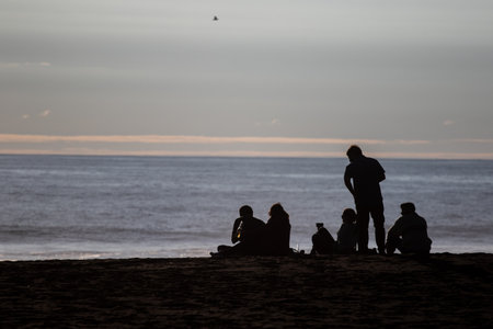 A sunset over a body of water and shadow, Pichilemu, Chileの写真素材