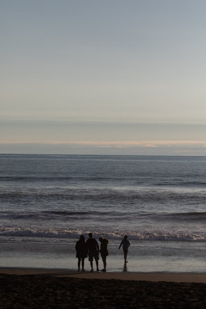 A sunset over a body of water and shadow, Pichilemu, Chileの写真素材