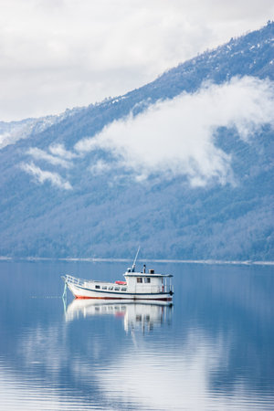 Rowing boat floating over Lake waters, travel South Americaの写真素材