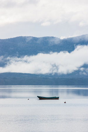 Rowing boat floating over Lake waters, travel South Americaの写真素材