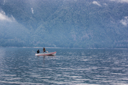 Rowing boat floating over Lake waters, travel South Americaの写真素材