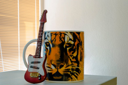 Guitar Cup and tiger painted on the mugの写真素材