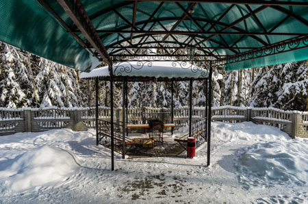 Barbecue in the gazebo under the canopy in winterの写真素材