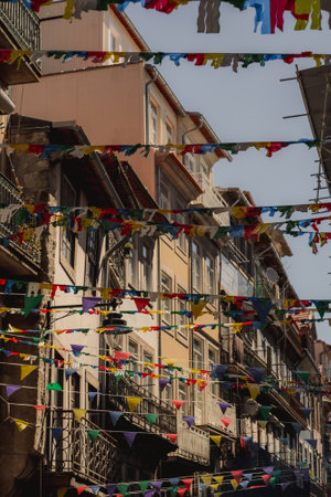 A row of buildings adorned with bright flags creates a colorful displayの写真素材