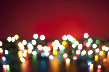 Bokeh lights background. Abstract multicolored light. Blur spot light. Defocus colorful light. Colorful blur light background. Defocused light. Bokeh light texture. Christmas blur light on red background. Light abstract. Circle multicolored blur light.の写真素材