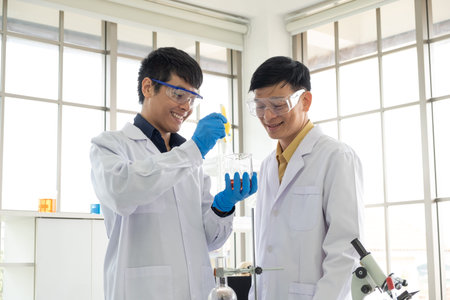 Science, Chemistry, Technology, Biology and Laboratory concept - Asian senior scientist and Asian...