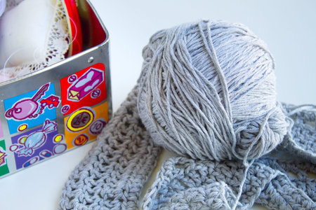 nice sewing box next to wool ball and handmade sweater