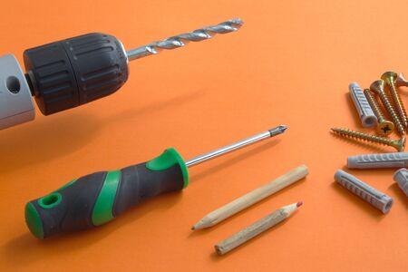 DIY tool set consisting of screws, dowels, screwdriver and drillの写真素材