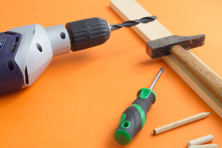 DIY tool set consisting of screws, dowels, drill machine and screwdriver