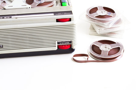 old tape recorder with magnetic tapes with recordings on white backgroundの写真素材