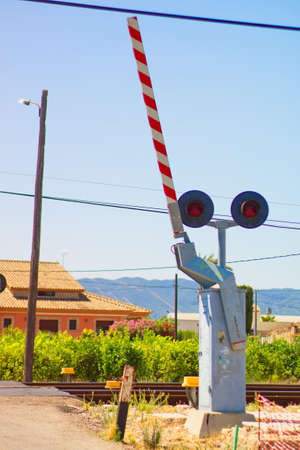 Traffic light indicating level crossing to warn of the passing of trainsの写真素材