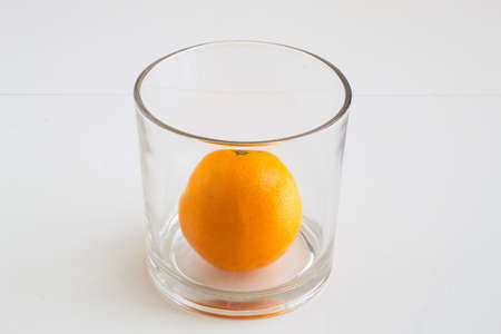 Orange tree project or orange juice. It depends on how you look at it. Orange in a glassの写真素材
