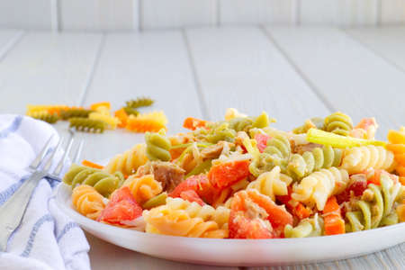 delicious and summery pasta salad with vegetablesの写真素材