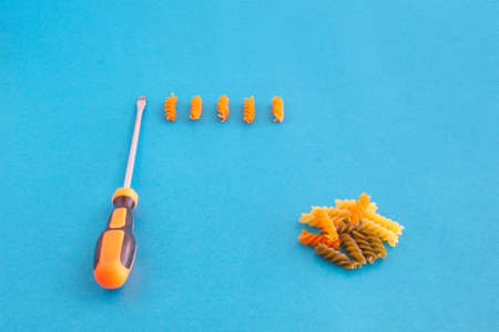 composition of colored spirals and screwdriver on eye-catching backgroundの写真素材