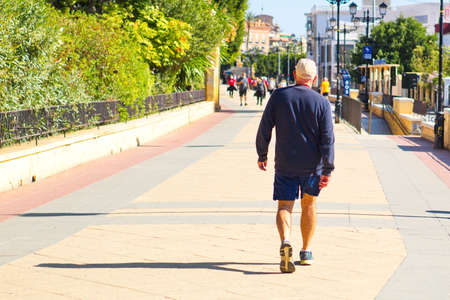 people doing healthy exercise outdoors on the Paseo del MalecÃ³nのeditorial素材