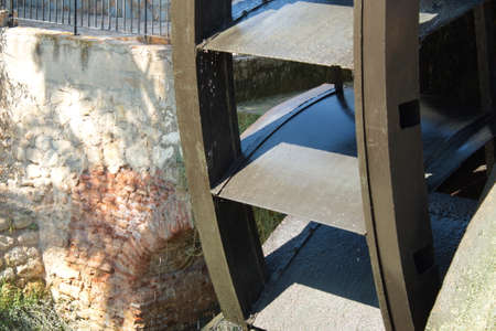 Old water wheel or ferris wheel to irrigate the garden of Murciaの写真素材