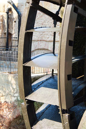 Old water wheel or ferris wheel to irrigate the garden of Murciaの写真素材