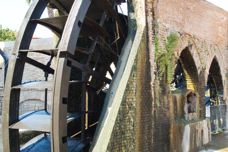 Old water wheel or ferris wheel to irrigate the garden of Murciaの写真素材