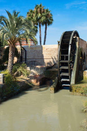 Old water wheel or ferris wheel to irrigate the garden of Murciaの写真素材