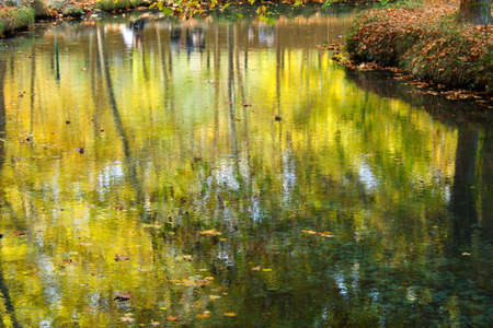 Calm stream of water that runs through the surroundings of the Fuentes del MarquÃ©s in Murciaの写真素材