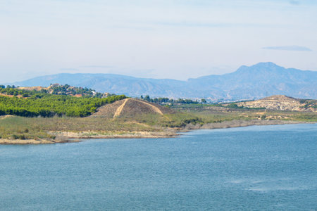 Nice panoramic view of the Santomera reservoir on a sunny dayの写真素材