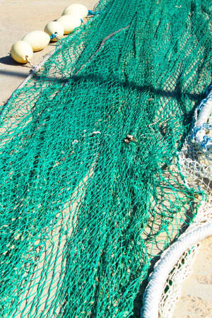 Colorful fishing nets ready to be shipped and used at seaの写真素材
