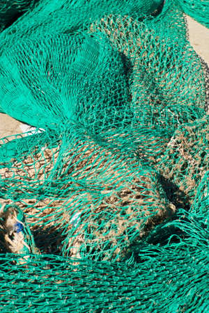 Colorful fishing nets ready to be shipped and used at seaの写真素材