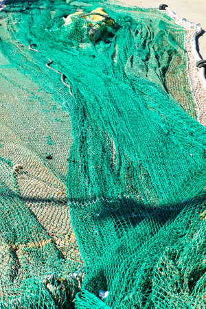 Colorful fishing nets ready to be shipped and used at seaの写真素材