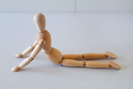 Wooden doll as a model for exercising in a healthy lifeの写真素材
