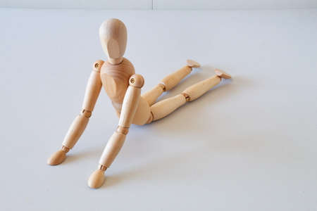 Wooden doll as a model for exercising in a healthy lifeの写真素材