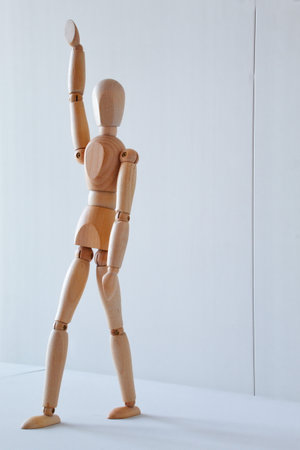 Greeting or leadership concept represented in a wooden dollの写真素材