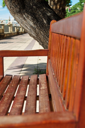 Lonely wooden bench for people to sit and restの写真素材