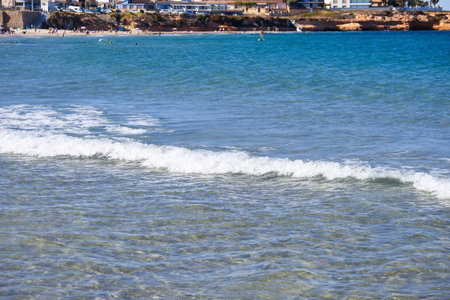 Striking scene of waves breaking on the sand of a Spanish beachの写真素材