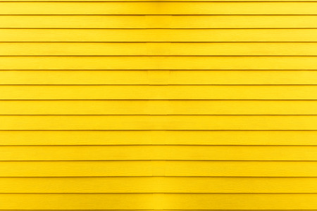 Yellow wooden wall texture backgroundの写真素材
