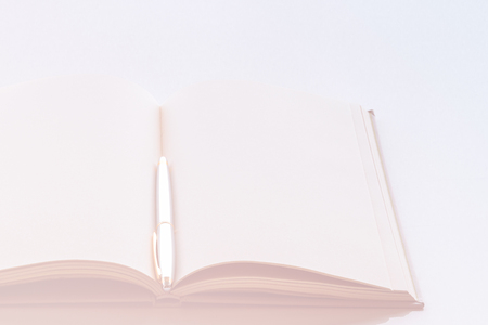 Opened book with blank pages on vintage background.  Soft focusの写真素材