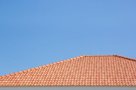 building a new roof of home, blue sky as background
