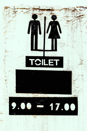 Restroom sign on cement wallの写真素材