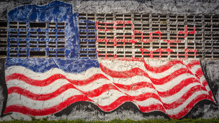 USA flag on old wall textureの写真素材