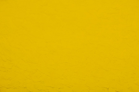 Yellow wall, yellow cement texture background.の写真素材