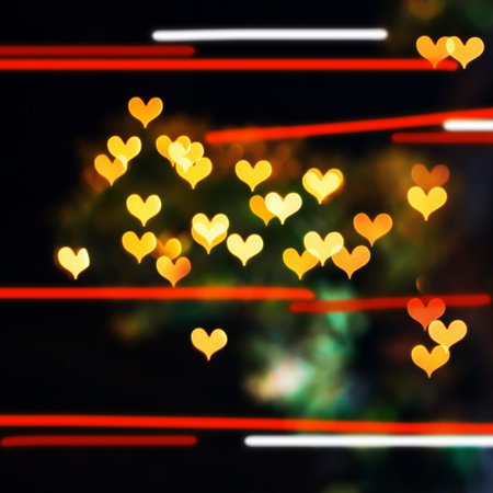 Colorful hearts bokeh on a dark background, orange heart bokeh.
