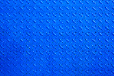 Blue metal floor plate texture and background.