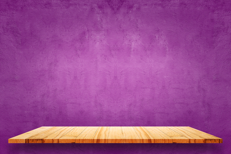 Empty wooden shelves and purple cement wall background. For display or montage your products.の写真素材