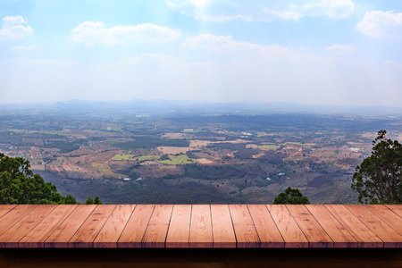 Empty wood table with view of landscape background. For display or montage your products.の写真素材