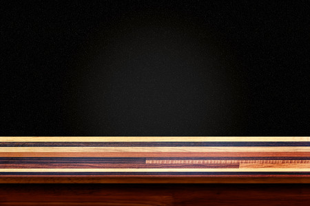 Empty wooden table with black wall background. For display or montage your products.の写真素材