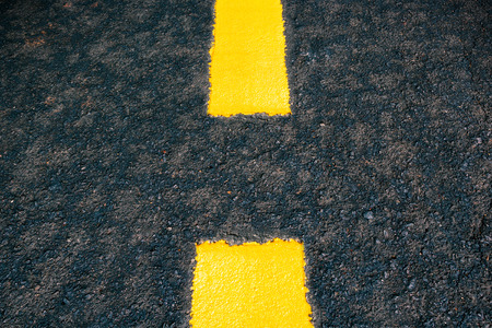 yellow line on the road texture backgroundの写真素材
