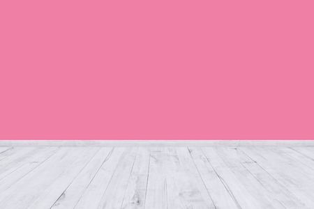 Pink room wall with white wood floor texture.の写真素材