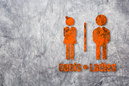 Toilet sign on bare concrete wall background.の写真素材