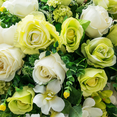 Beautiful plastic rose flowers background.の写真素材