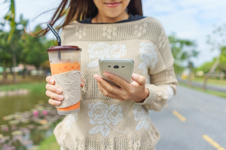 Close up a woman using mobile smart phoneの写真素材