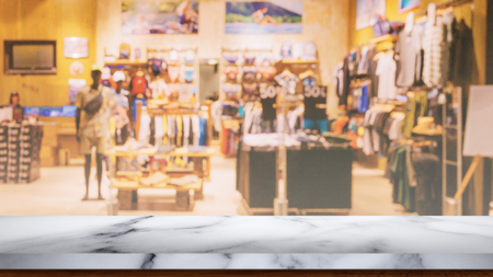 Empty wooden table with blur shopping mall background. For display or montage your products.の写真素材